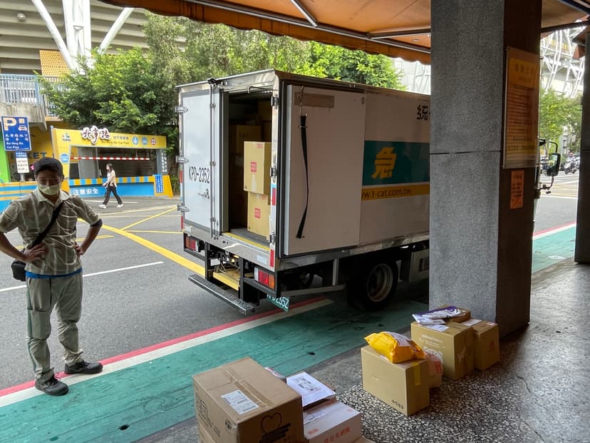 A delivery van with rear door open