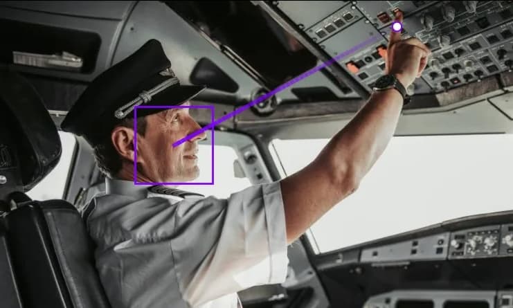 Operator at a control panel with a flashing alert